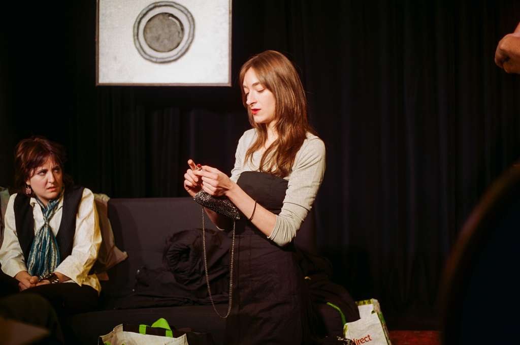 Putting on her face.