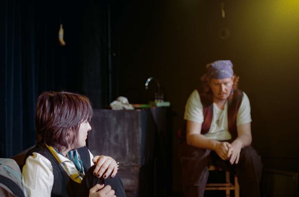Two people and one banana, discussing the work.